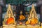 Three Buddha sit in Thai Temple