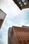 Three Buildings in the blue sky while Looking Up