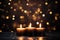 Three burning candles creating a celebratory mood, enhanced by the blurred lights. This image encapsulates the festive concept and