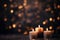 Three burning candles creating a celebratory mood, enhanced by the blurred lights. This image encapsulates the festive concept and