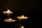 Three burning candles in the darkness. Mystery background