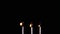 Three Burning Matches with a Bright Flame on a Black Background in Empty Space