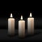 Three burning realistic pillar candle on black background