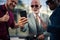 Three business men standing on street and using smart phone. Focus is on hands Business photography