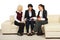 Three business women discussion on sofa