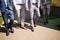 Three businessmen walking in a financial area while having a conversation - Work colleagues going to work