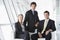 Three businesspeople sitting in office lobby