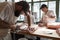 Three butchers preparing meat,cuts of meat in butcher\'s shop, cl