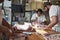 Three butchers preparing meat,cuts of meat to sell at a butcher\'