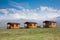 Three cabins against blue sky