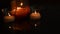 Three candles burn and reflect