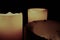 Three candles glow in dark