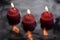 Three candles reflecting in water