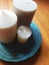 Three candles on a wooden brown floor