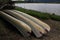 Three Canoes on the Edge of a Lake