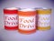 Three cans in red orange yellow on white with the words food drive
