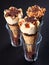 Three caramel ice cream cones on dark background
