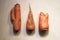 Three carrots on wooden background