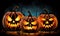 Three carved jack o lantern pumpkins sitting on a table