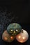 Three carved pumpkins glowing on black background