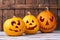 Three carved pumpkins for Halloween.