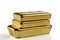 Three cast gold bars are in a pile. Isolated on a white background