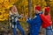 Three caucasian friends laughing during hike, adventure in the forest