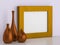 Three ceramic vases and golden frame for picture