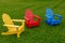 Three Chairs Yellow Red Blue on Grass