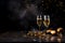 Three champagne glasses, gold streamers and confetti on dark background.New Year\\\'s Eve background, banner.