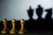 Three chess pawn casting Queen King and Knight shadow in dark concept of strength or aspirations