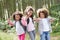 Three Children Exploring Woods Together