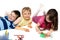 Three Children Happily Drawing