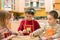 Three children molding cookies from dough. Two girls and a boy