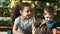 Three children in the park, playing in the open air with bubbles