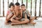 Three children sit and watch the smartphone happily. young boys and girls with cellphone communication. on the terrace of their