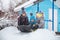 Three children sledding in winter