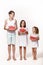 Three children in the studio stand on a white background and hold pieces of watermelon.