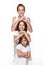 Three children in the studio on a white background, a brother and two sisters laugh