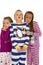 Three children wearing winter pajamas with frightened expression