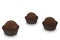 Three chocolate truffle sweets isolated on white background