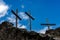 Three Christian crosses on blue sky with clouds