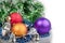 Three Christmas balls with blue beads, green garland and silver