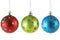 Three Christmas balls with colorful spots