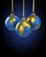 Three christmas balls shaped as globe or planet
