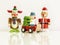 three Christmas figures reindeer Santa Claus toys