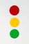 Three circular filters in red, yellow, and green colors in line on white background.