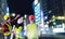 Three civil engineer team looking at modern neon City for construction industry success concept