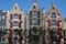 Three classical holland houses with shutters on the street in the day