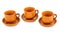 Three clay teacups with saucers